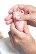 massaging foot of little baby