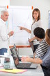 Group of people discussing a growth chart