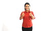 Happy young businesswoman with thumbs up in front