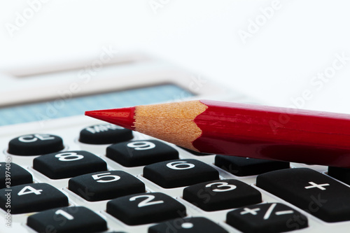 Photo: Rotstift und Taschenrechner Rotstift und Taschenrechner