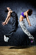 Young dancer couple jumping