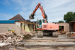 Destruction of a building by a caterpillar crane