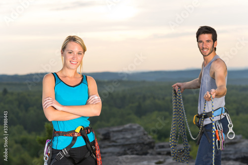 Photo: Rock climbing active people on top sunset Rock climbing active people on top sunset