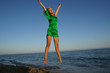 Girl jumping in the sea