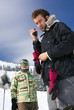 Two backcountry freeriders are standing with the radio