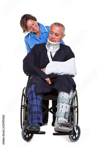Photo: Nurse and injured man in wheelchair isolated Nurse and injured man in wheelchair isolated