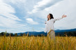 Girl holding arms up against blue sky Girl holding arms up against blue sky