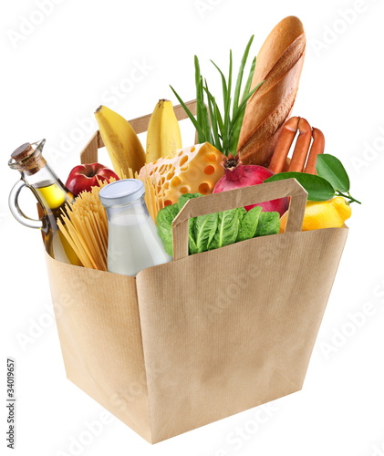 Photo: Paper bag with food on a white background. Paper bag with food on a white background.