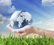 holding a glowing earth globe in his hands holding a glowing earth globe in his hands