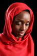 African American muslim girl in hijab looks down