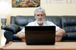 Elderly man in front of a laptop Elderly man in front of a laptop