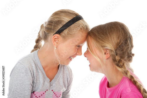 Foto: two girls laughing heads together two girls laughing heads together