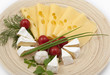 Various types of cheese on a wooden board Various types of cheese on a wooden board