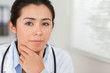 Lovely female doctor with a stethoscope posing
