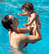 Mother with son in pool
