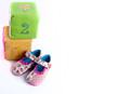 Baby shoes on white
