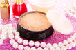makeup powder on pink background