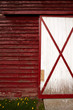 Photo: Wall and the door on the old red barn in the countryside. Wall and the door on the old red barn in the countryside.