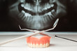 Pan x-ray, denture and dental instruments.