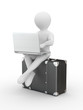 Man with laptop on the luggage
