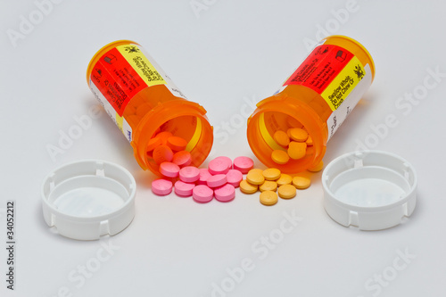 Photo: Two bottles of pills spilled Two bottles of pills spilled