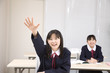 Photo: 手をあげる女子中学生 手をあげる女子中学生