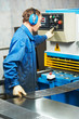 worker operating guillotine shears machine