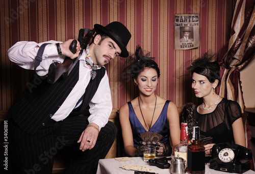 Photo: Gangsters playing cards. Gangsters playing cards.
