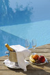 Photo: Champagne at poolside with plate of fruits and glasses Champagne at poolside with plate of fruits and glasses