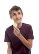 Photo: Boy with potato crisp looking sideways Boy with potato crisp looking sideways
