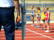 Girls on the start against the background of a starter pistol