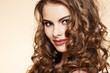 Beautiful woman model with ringlet hairstyle and bright make-up