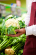 Man in supermarket as shop assistant