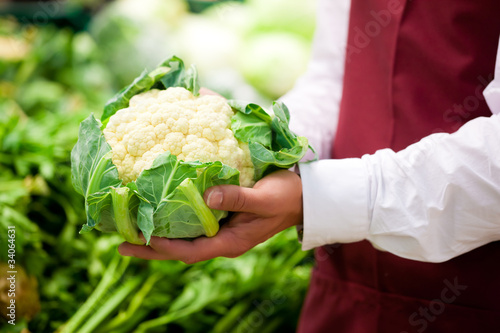 Photo: Man in supermarket as shop assistant Man in supermarket as shop assistant