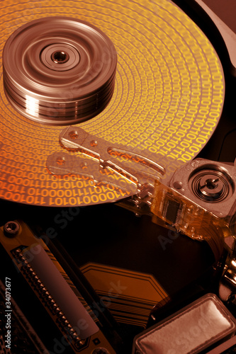 Photo: open hard disk with symbolized data open hard disk with symbolized data
