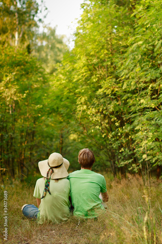 Photo: relaxation of young couple in the forest relaxation of young couple in the forest