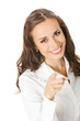 Businesswoman pointing finger at viewer, isolated on white