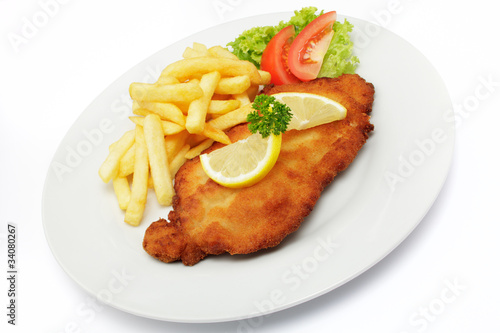 Photo: Schweineschnitzel Wiener Art mit Pommes frites Schweineschnitzel Wiener Art mit Pommes frites