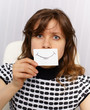 Woman with very unnatural smile on face