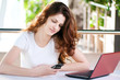 A young business woman sitting in a cafe A young business woman sitting in a cafe