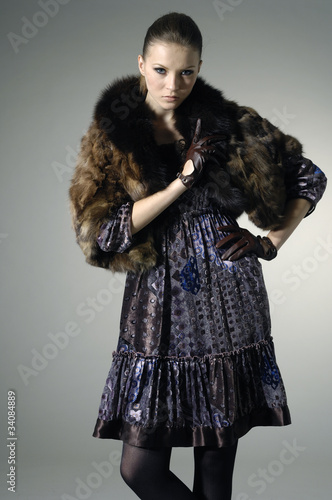 Photo: High fashion model in winter fur coat clothes posing High fashion model in winter fur coat clothes posing