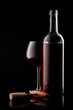 white bottle with red wine and glass and cork with a corkscrew