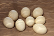 Unhatched ostrich eggs lying in the sand with filtered sunlight Unhatched ostrich eggs lying in the sand with filtered sunlight