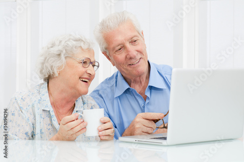 Photo: Senior couple at laptop Senior couple at laptop