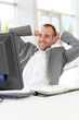 Portrait of relaxed salesman in office