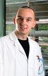 Young scientist in while lab coat