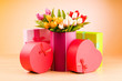 Giftbox and tulips against gradient background