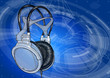 Headphones on blue technology background