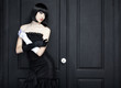 Fashion portrait of young beautiful woman in the black dress Fashion portrait of young beautiful woman in the black dress
