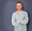 Handsome man standing on blue background